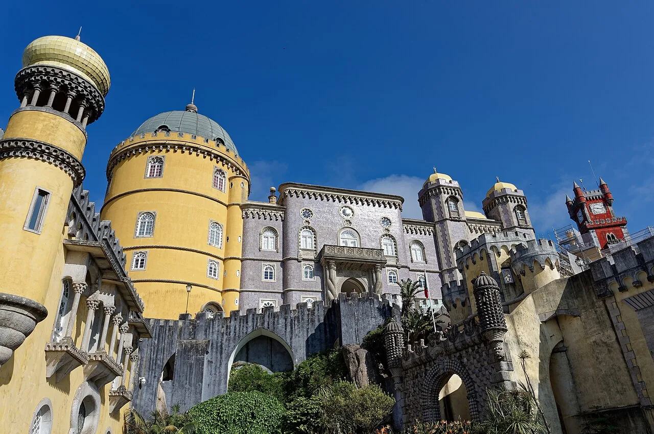 The yellow facade and red towers of Pena Palace in Sintra, Portugal